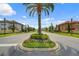 Palm tree-lined entrance to a residential community at 600 Via Chris Ct, Debary, FL 32713
