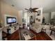 Spacious living room with hardwood floors, and a large TV at 2800 Tropic Ct, Winter Garden, FL 34787