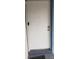 White front door with keyless entry and two door knobs at 4721 Watch Hill Ct, Orlando, FL 32808