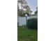 Landscaped front yard with white fence and a lighted post at 4721 Watch Hill Ct, Orlando, FL 32808