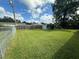 Large backyard with grassy lawn, shed, and playground at 5937 Colchester Dr, Orlando, FL 32812