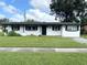 Ranch-style home with fresh white paint at 5937 Colchester Dr, Orlando, FL 32812