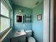 Small bathroom with light blue walls and a white vanity at 5937 Colchester Dr, Orlando, FL 32812