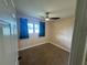 Bright bedroom with neutral walls and carpet at 5937 Colchester Dr, Orlando, FL 32812