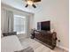 Bright bedroom with a double bed, dresser, and plenty of natural light at 4813 Terra Sole Place, St Cloud, FL 34771