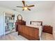 Bedroom with a king-size bed, dresser, and bookcase at 4813 Terra Sole Place, St Cloud, FL 34771