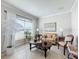 Cozy sitting area with a comfortable sofa and large window at 4813 Terra Sole Place, St Cloud, FL 34771