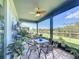 Screened patio with seating area and view of pond at 4813 Terra Sole Place, St Cloud, FL 34771