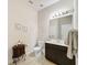 Clean bathroom with dark vanity and tile flooring at 4813 Terra Sole Place, St Cloud, FL 34771