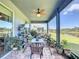 Screened patio with seating area and view of pond at 4813 Terra Sole Place, St Cloud, FL 34771