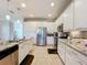 Spacious kitchen with an island, stainless steel appliances, and granite countertops at 4813 Terra Sole Place, St Cloud, FL 34771