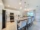 Modern kitchen with white cabinets, granite countertops, and an island at 4813 Terra Sole Place, St Cloud, FL 34771