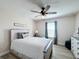 Charming bedroom with a queen bed and farmhouse-style dresser at 4813 Terra Sole Place, St Cloud, FL 34771
