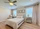 Bedroom with queen bed and gray upholstered chair at 4813 Terra Sole Place, St Cloud, FL 34771