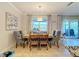 Charming dining room with a wooden table and gray upholstered chairs at 4813 Terra Sole Place, St Cloud, FL 34771