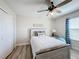 Bright bedroom with a queen bed, built-in closet, and ceiling fan at 4813 Terra Sole Place, St Cloud, FL 34771