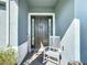 Front entrance with rocking chair and welcoming decor at 4813 Terra Sole Place, St Cloud, FL 34771
