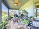 Relaxing screened patio with brick pavers, seating area, and lush greenery at 4813 Terra Sole Place, St Cloud, FL 34771