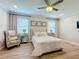 Spacious bedroom with a queen-size bed and wood floors at 4813 Terra Sole Place, St Cloud, FL 34771