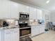 Modern kitchen with stainless steel appliances and granite countertops at 4813 Terra Sole Place, St Cloud, FL 34771