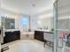 Elegant bathroom with soaking tub and walk-in shower at 4813 Terra Sole Place, St Cloud, FL 34771