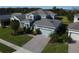 Two-story house, gray roof, paver driveway, and a landscaped yard at 4813 Terra Sole Place, St Cloud, FL 34771