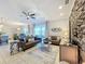 Spacious living area featuring a stone fireplace and comfortable seating at 4813 Terra Sole Place, St Cloud, FL 34771