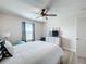 Bedroom with a queen bed, dresser, and ceiling fan at 4813 Terra Sole Place, St Cloud, FL 34771