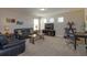 Living room with sectional sofa, coffee table and workspace at 5295 Wildwood Way, Davenport, FL 33837
