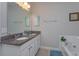 Double vanity bathroom with granite countertop at 5295 Wildwood Way, Davenport, FL 33837