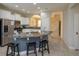 Modern kitchen with stainless steel appliances and breakfast bar at 5295 Wildwood Way, Davenport, FL 33837
