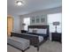 Main bedroom with king-size bed and ensuite bathroom at 5295 Wildwood Way, Davenport, FL 33837