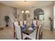 Elegant dining room featuring a glass table and chandelier at 5295 Wildwood Way, Davenport, FL 33837