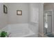 Bathroom with garden tub and walk-in shower at 5295 Wildwood Way, Davenport, FL 33837