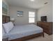 Bedroom with a double bed, dresser, and TV at 5295 Wildwood Way, Davenport, FL 33837