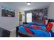 bedroom with twin beds and Marvel and Spiderman wall art at 5295 Wildwood Way, Davenport, FL 33837