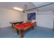 Game room features a pool table and air hockey table at 5295 Wildwood Way, Davenport, FL 33837