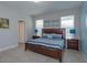 Bedroom with king-size bed and ensuite bathroom at 5295 Wildwood Way, Davenport, FL 33837