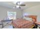 Bedroom with a bed, keyboard, and window overlooking the backyard at 5631 La Joya Ct, Orlando, FL 32808