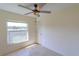 Empty bedroom featuring tile floors and a window with a view at 5631 La Joya Ct, Orlando, FL 32808