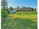 Landscaped backyard with grassy area and privacy fence at 10714 Inside Loop, Orlando, FL 32825