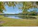 Serene pond with lush greenery and clear reflection at 10714 Inside Loop, Orlando, FL 32825