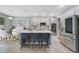 Modern kitchen with an island, stainless steel appliances, and white cabinets at 3149 Jade Tree Pt, Oviedo, FL 32765