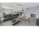 Open living room and kitchen with modern furniture and neutral tones at 3149 Jade Tree Pt, Oviedo, FL 32765
