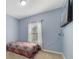 Cozy bedroom with a window and neutral wall color at 3149 Jade Tree Pt, Oviedo, FL 32765
