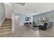 Spacious living room with a staircase, TV, and comfortable seating at 3149 Jade Tree Pt, Oviedo, FL 32765
