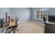 Bright home office features built-in shelving and large window at 3149 Jade Tree Pt, Oviedo, FL 32765