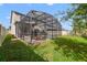 Spacious backyard with a screened pool and lush grass at 3149 Jade Tree Pt, Oviedo, FL 32765