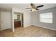 Bright bedroom with ceiling fan and en-suite bathroom at 913 Sycamore Ln, Altamonte Springs, FL 32714