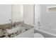 Bathroom with granite countertop, white vanity, and bathtub at 164 Holly Village Dr, Davenport, FL 33837